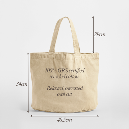 A beige canvas tote bag with dimension arrows and labels showing its height as 34cm, width as 48.5cm, and handle height as 29cm, on a light grey background.