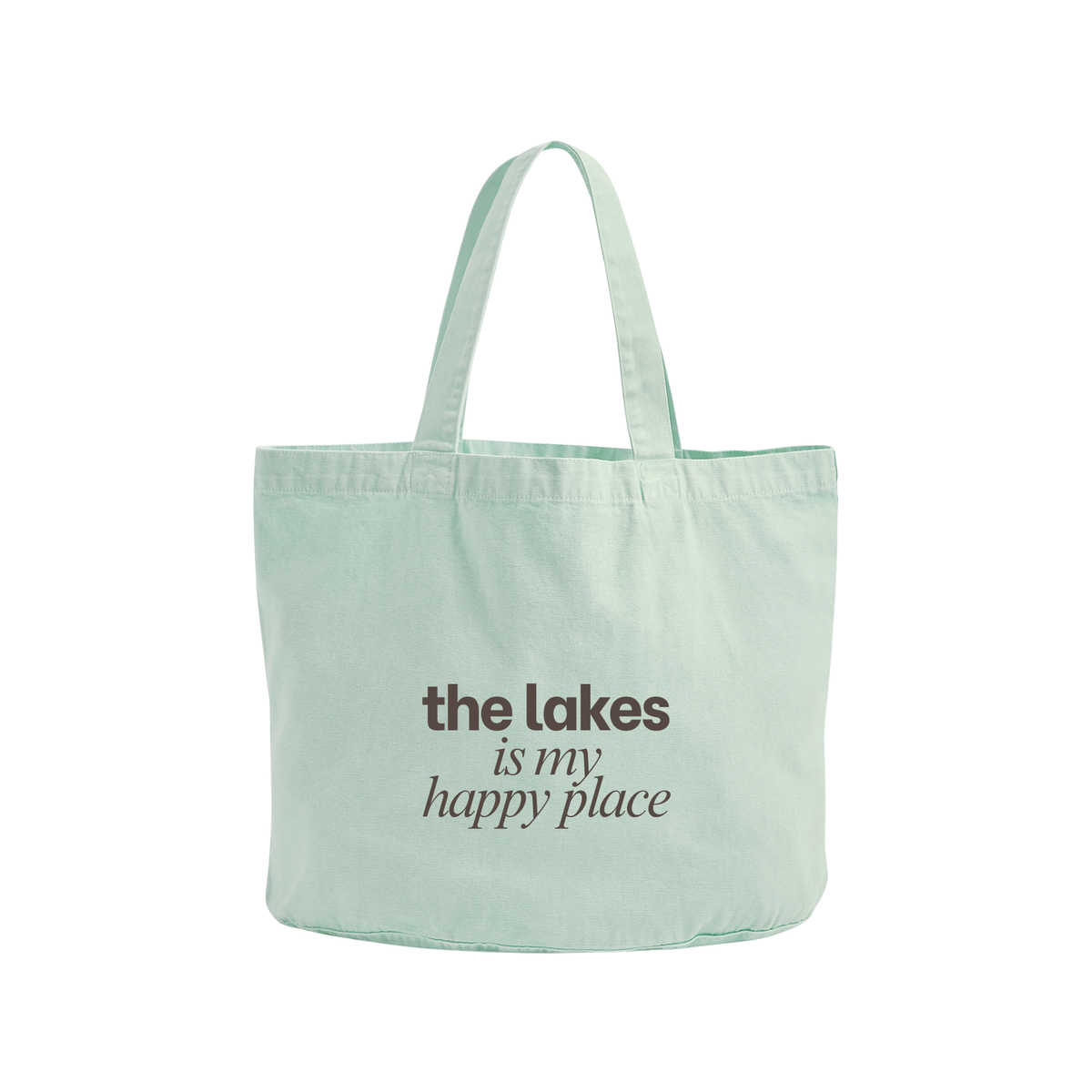 A mint green canvas tote bag with the printed text 'the lakes is my happy place' in dark brown, shown against a plain white background.